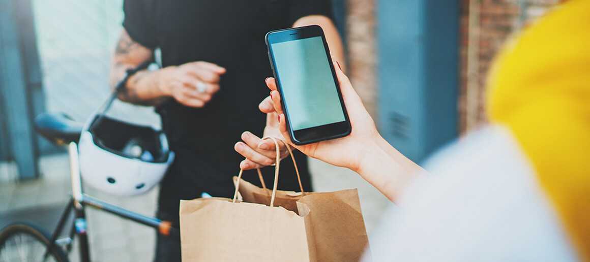 A gig economy worker delivering a package to a customer