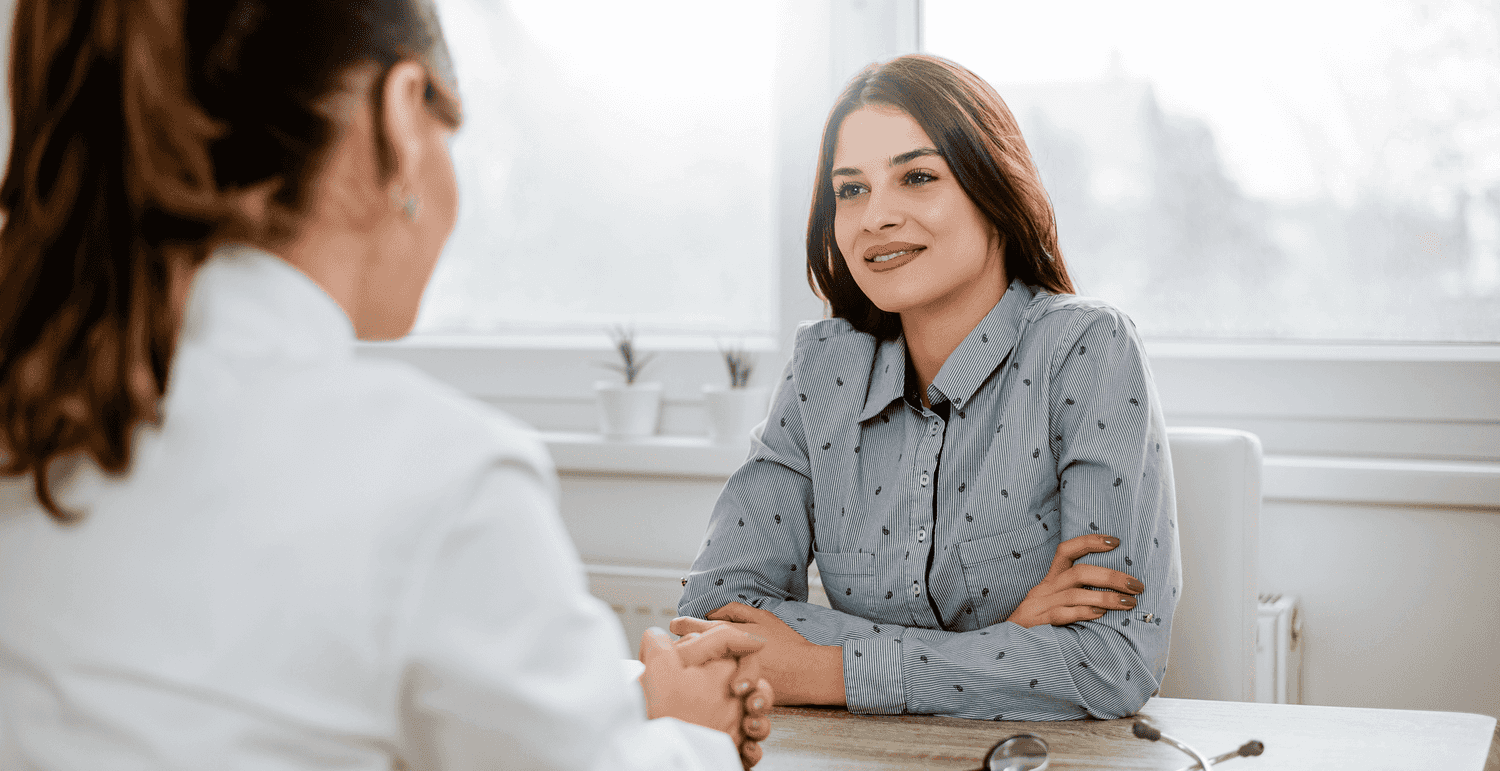 A female patient talking to a female doctor