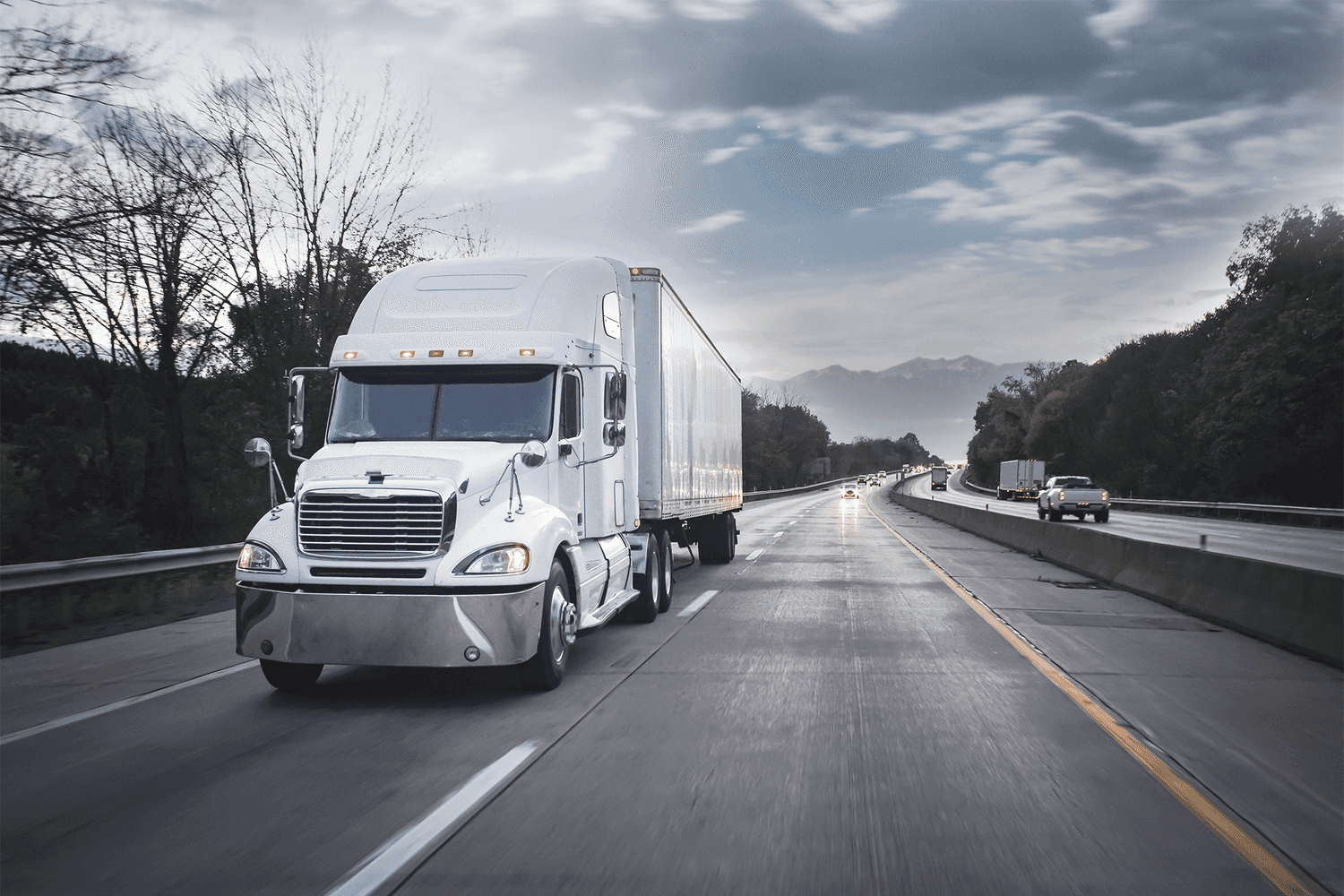 A May Trucking Company semi-truck driving on the road