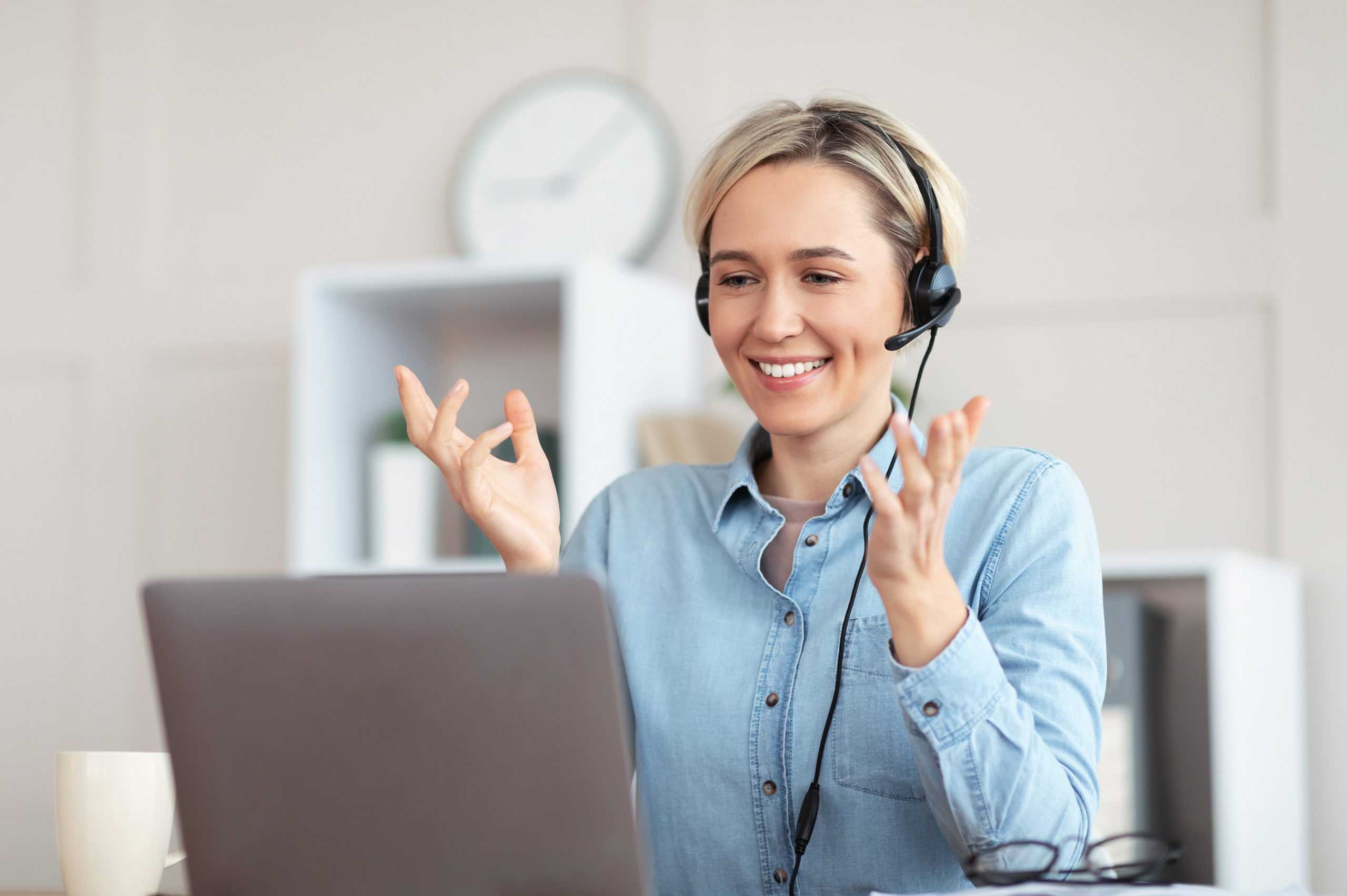 a smiling woman on an advocacy 24/7 telehealth appointment with a corvel medical provider