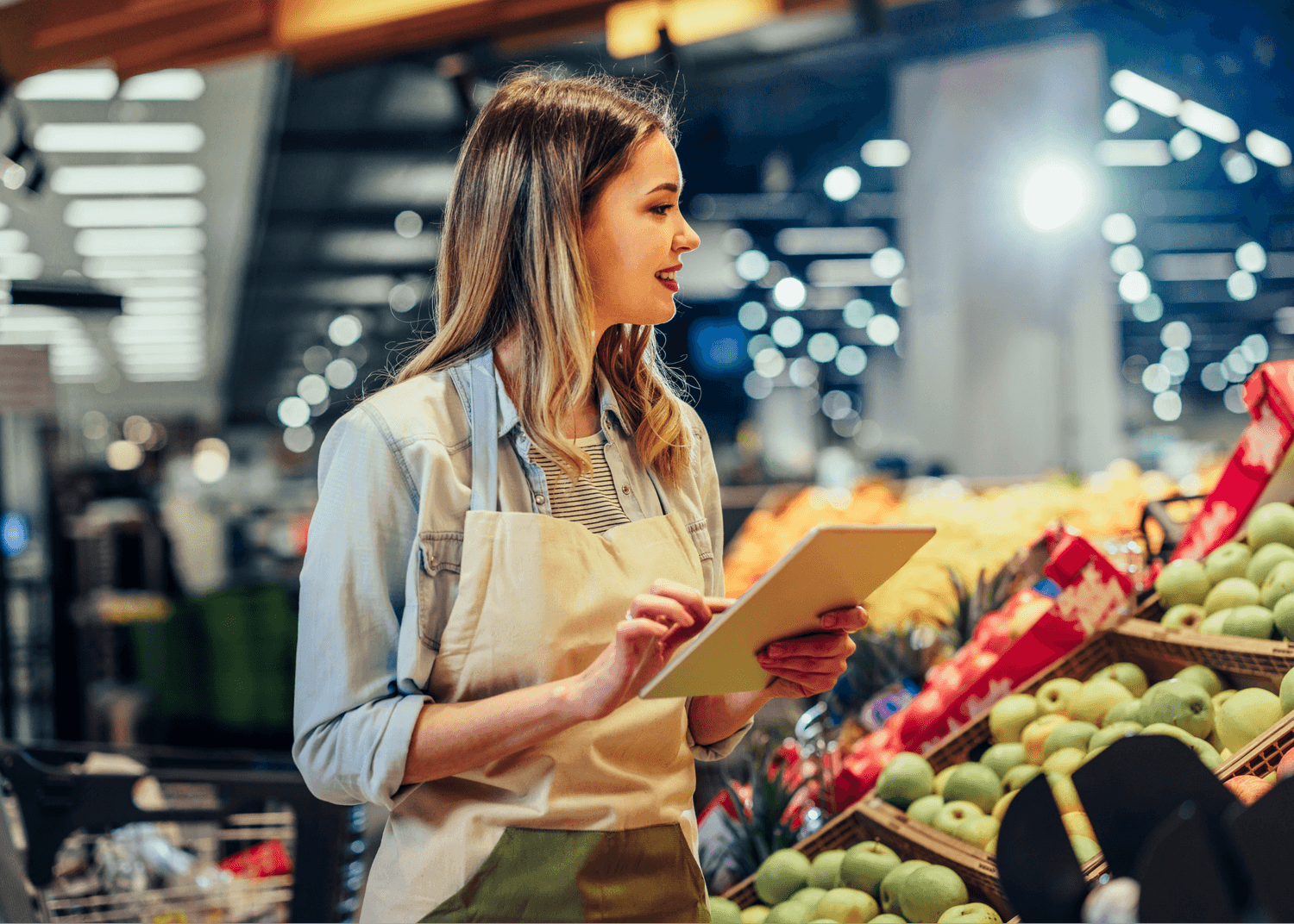 Woman working at grocery store benefitting from CorVel's Ancillary Care Solutions