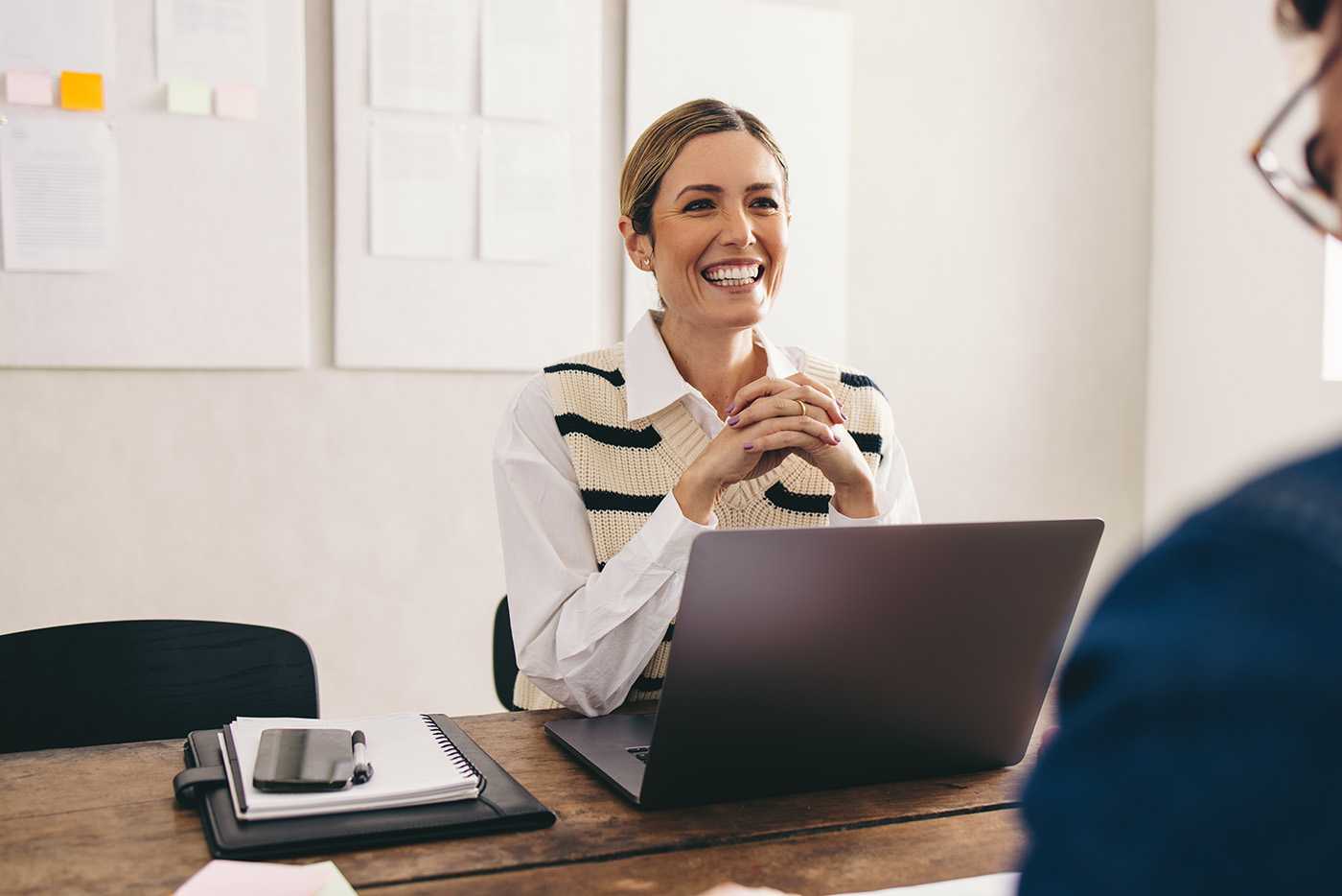 a manager in her office interviewing a candidate for an open position at corvel