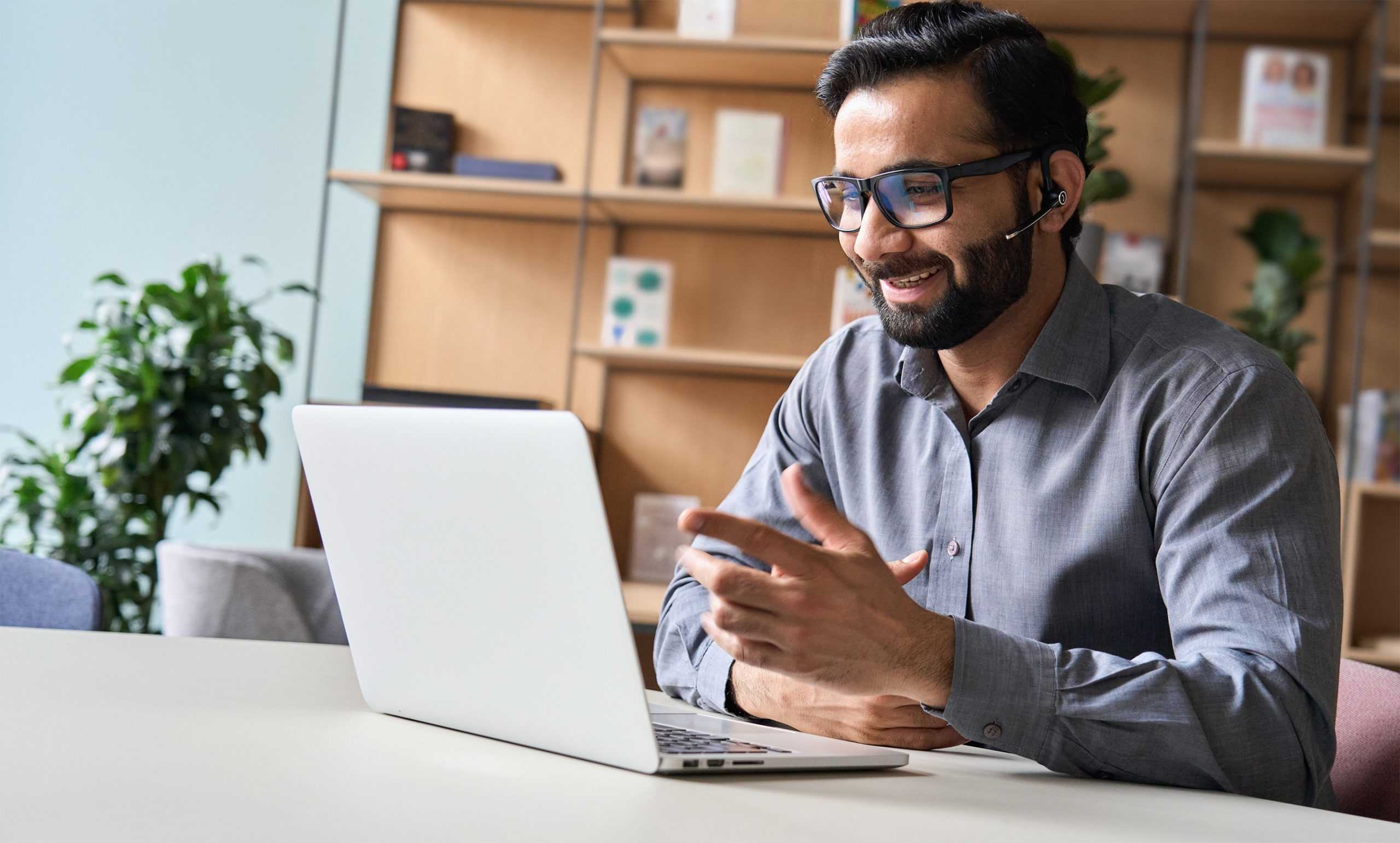 a male telephonic case manager in his office on a video call with his client