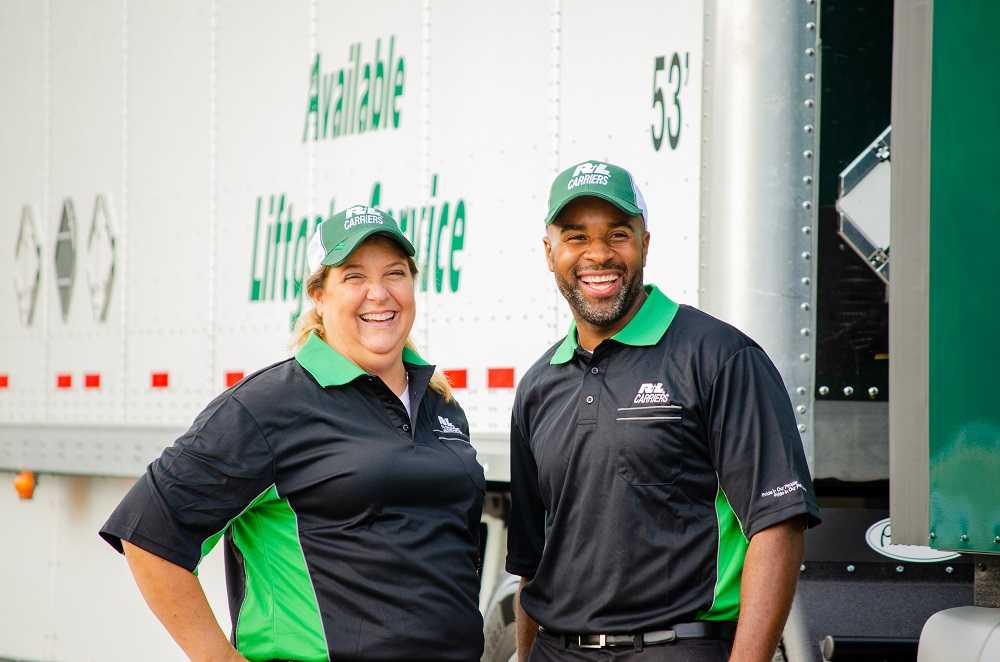 Two happy R+L Carriers employees covered by CorVel's workers' comp care.